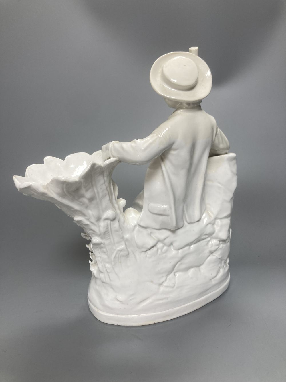 A pair of John Bevington bone china figures, gardener and female companion, 21.5cm